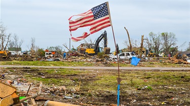 American flag waving after devastating tornado