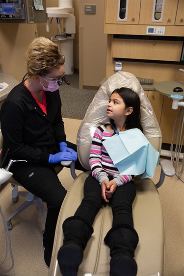 Dental hygienist working on a child
